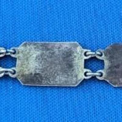Antique silver link bracelet with different scenes or characters on each link
