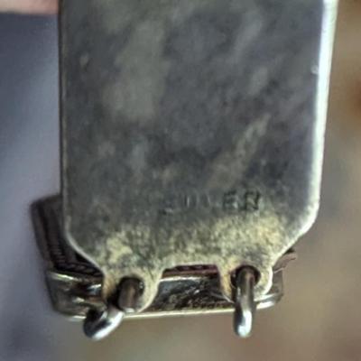Antique silver link bracelet with different scenes or characters on each link