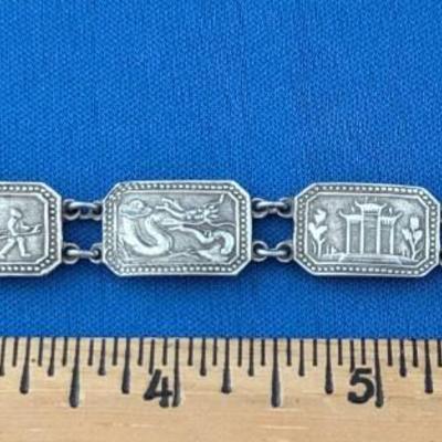 Antique silver link bracelet with different scenes or characters on each link