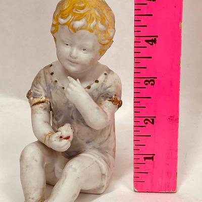 Antique Vintage Bisque Porcelain Figurine Child Baby sitting with fruit