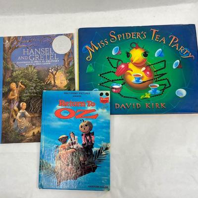 3 Children's Books: Miss Spider's Tea Party, Return to Oz, and Hansel and Gretel.
