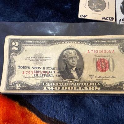 1953 C series Two Dollar bill with Gulfport MS advertising on it