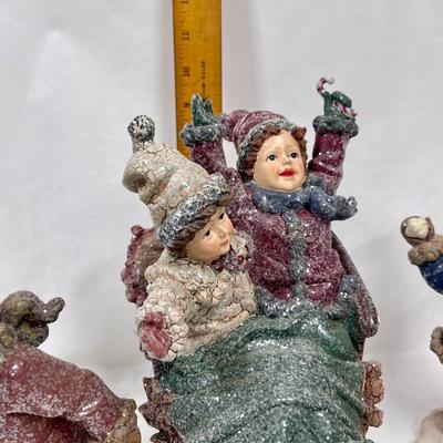 Set of Winter Christmas Themed Figurines Children on Skates and Sled