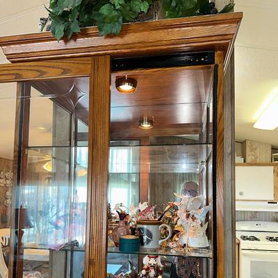 218 OAK CURIO CABINET WITH LOCKING SLIDING DOOR AND LIGHT 80" TALL