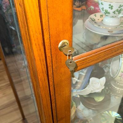 218 OAK CURIO CABINET WITH LOCKING SLIDING DOOR AND LIGHT 80" TALL
