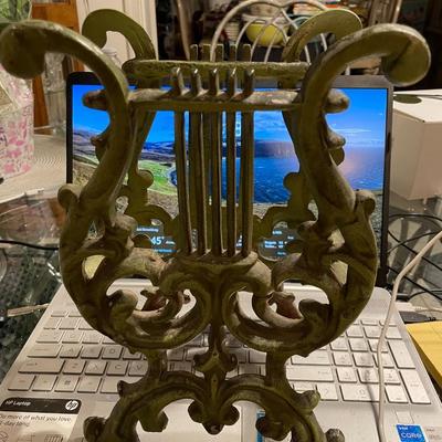 Vintage Mid-Century Modern 11" Tall Cast Iron Magazine Rack in Good Preowned Condition.