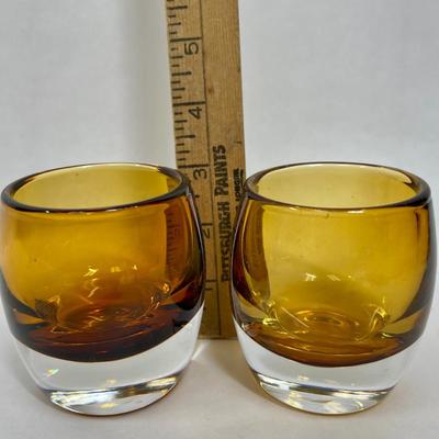 2 Amber candleholders with clear bottom