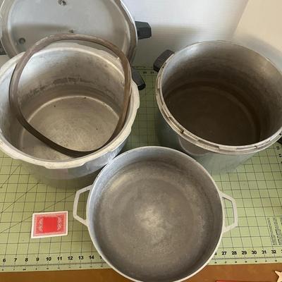 1 Pressure Cooker, 1 Pan, & 1 bottom of a pressure cooker