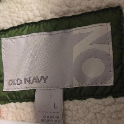 Green Puffer Vest and Dark Green Athletic Pants