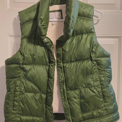 Green Puffer Vest and Dark Green Athletic Pants