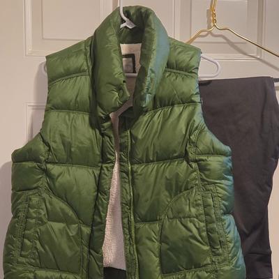 Green Puffer Vest and Dark Green Athletic Pants