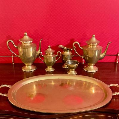 Brass tea set with handled tray, has two tea pots, sugar with cover, creamer, waist bowl