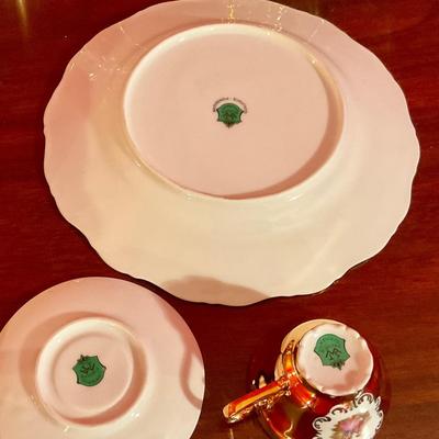Porcelain tea set with Victorian figures and gold trim, teapot, sugar with lid, creamer, waste bowl, two tea cups and saucers, plus Cale...