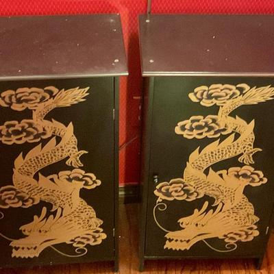 2 black cabinets with gold dragons, have shelves for storage