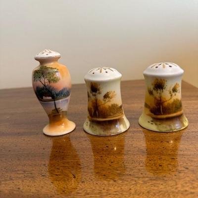 A Collection of Salt & Pepper Shakers with Sugar Trinket