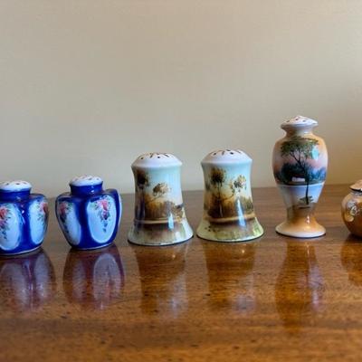 A Collection of Salt & Pepper Shakers with Sugar Trinket