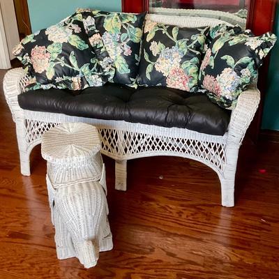 White wicker settee and elephant coffee table