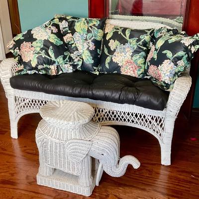 White wicker settee and elephant coffee table