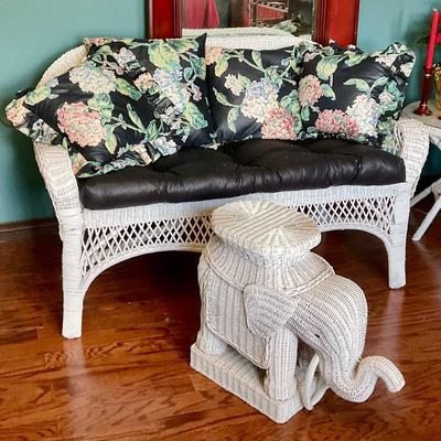 White wicker settee and elephant coffee table