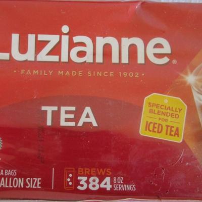 3 boxes of Luzianne ice tea bags and 1 can of Cappuccino