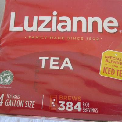 3 boxes of Luzianne ice tea bags and 1 box of Extra Caff