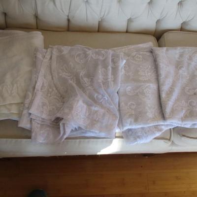 Assortment Of Curtains Some Are Valances With Black Curtain Attached