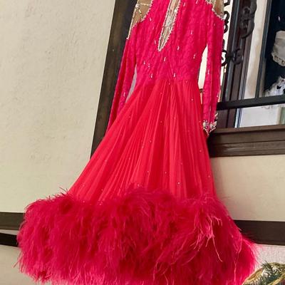 Vintage dancing dress has feather trim on bottom, very nice