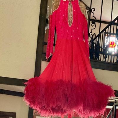 Vintage dancing dress has feather trim on bottom, very nice