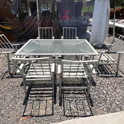 Lot# 193 Outdoor Metal Table with Plexiglass Top & Six Chairs