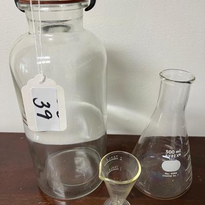 collectable pyrex measuring cups and antique glass apothecary jar w/ clamp