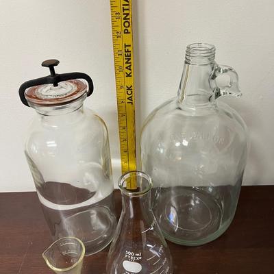 collectable pyrex measuring cups and antique glass apothecary jar w/ clamp
