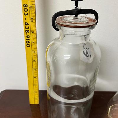collectable pyrex measuring cups and antique glass apothecary jar w/ clamp