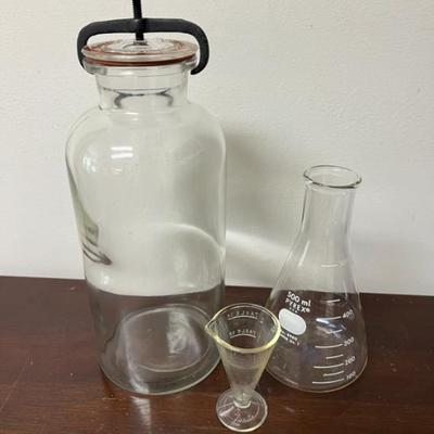 collectable pyrex measuring cups and antique glass apothecary jar w/ clamp