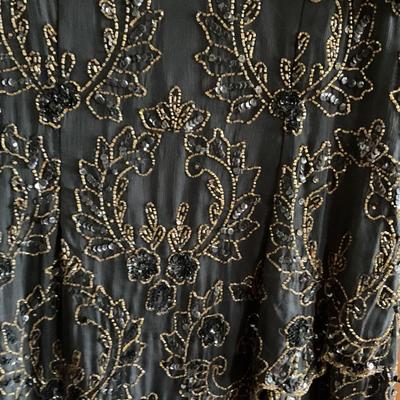 Black and gold sequined dress by Ste’na