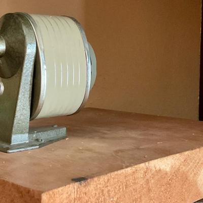 Vintage pencil sharpener mounted on wood block