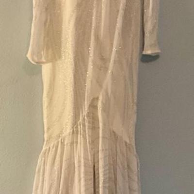 Elegant sparkly white dress with ruffles