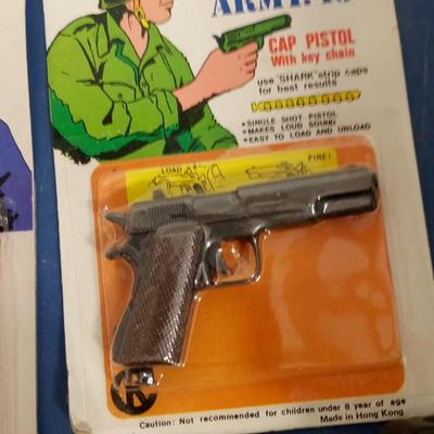 LOT 10 FOUR VINTAGE CAP GUNS
