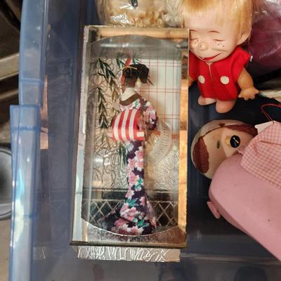 Container full of Vintage Dolls