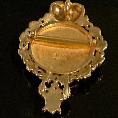 Black and gold pin/ broach with floral motif