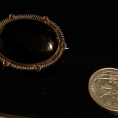 Sterling silver broach with black stone