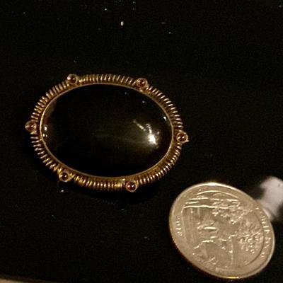 Sterling silver broach with black stone