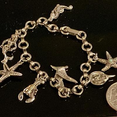 Costume sea life charm bracelet, has mermaid, lobster, starfish and more