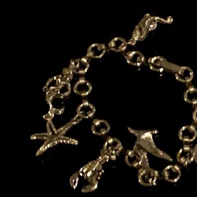 Costume sea life charm bracelet, has mermaid, lobster, starfish and more