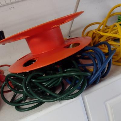 Assortment of Extension Cords and Reel