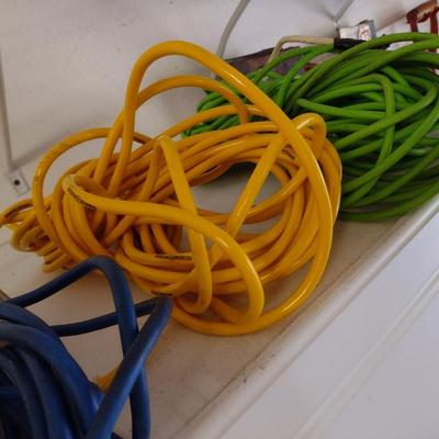 Assortment of Extension Cords and Reel