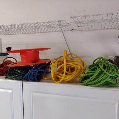 Assortment of Extension Cords and Reel