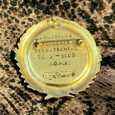 NOMA pin celebrating Louisiana purchase bicentennial, gold tone