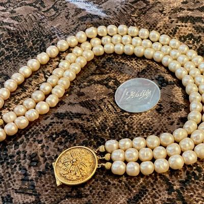 Faux pearl choker with brass medallion clasp