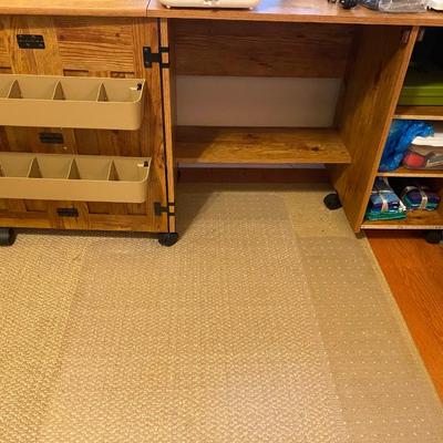 Modern sewing machine cabinet on casters