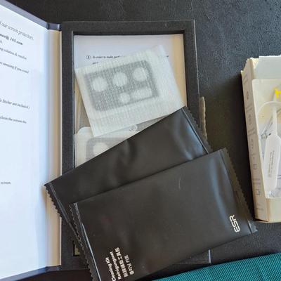 Electronics Cloth, Wireless Earbuds, and Tempured Glass Phone Camera Covers